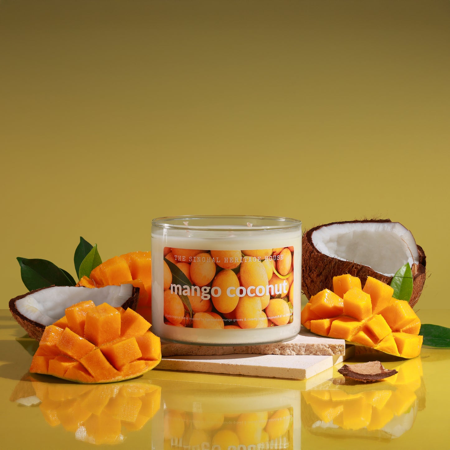 Three-wick mango coconut candle in a 14 oz glass jar